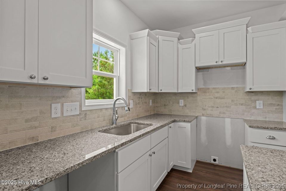 200 Dove Road Cameron, NC 28326 - Photo 19 of 46 a kitchen with a sink cabinets and window
