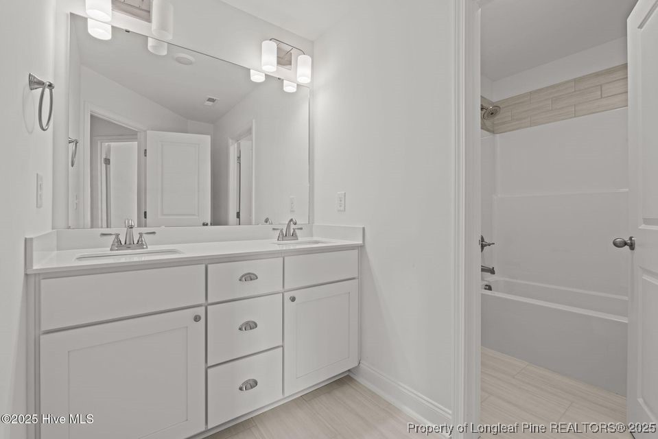 200 Dove Road Cameron, NC 28326 - Photo 26 of 46 a bathroom with a shower sink vanity and mirror