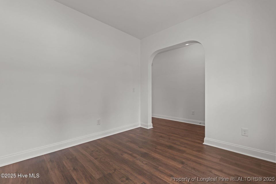 200 Dove Road Cameron, NC 28326 - Photo 9 of 46 a view of an empty room with wooden floor and a window