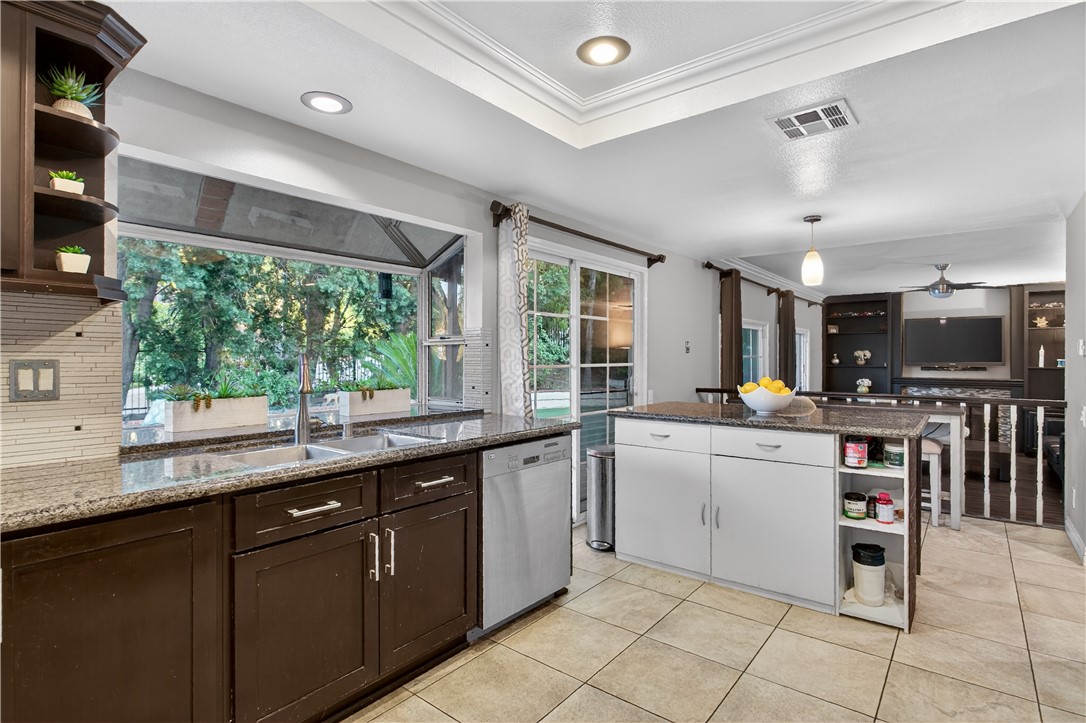 720 Ridgeview Road Anaheim Hills, CA 92807 - Photo 12 of 36 a kitchen with stainless steel appliances granite countertop a sink and cabinets