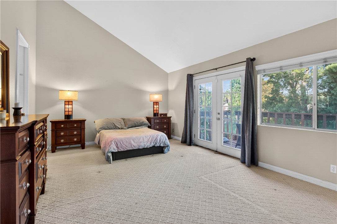 720 Ridgeview Road Anaheim Hills, CA 92807 - Photo 18 of 36 a spacious bedroom with a bed and large windows