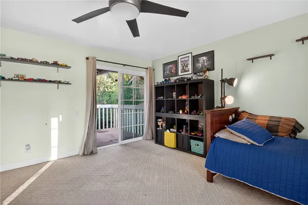 a bed room with a bed and a book shelf