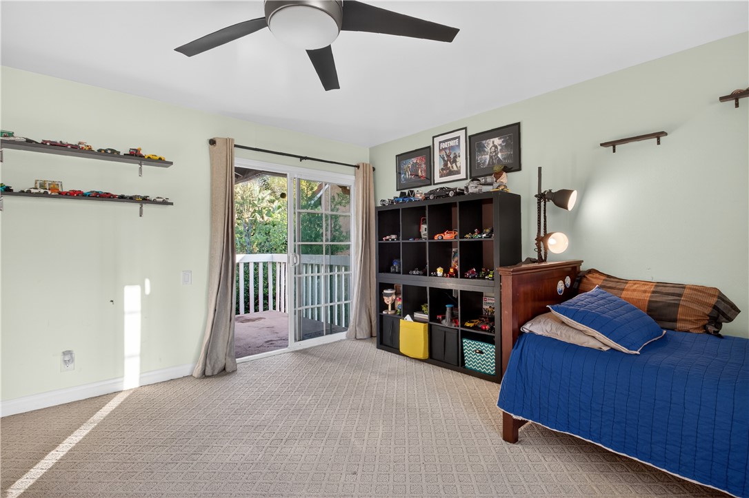 720 Ridgeview Road Anaheim Hills, CA 92807 - Photo 28 of 36 a bed room with a bed and a book shelf