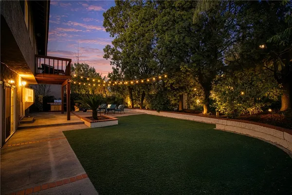 a view of a swimming pool with an outdoor space and seating area