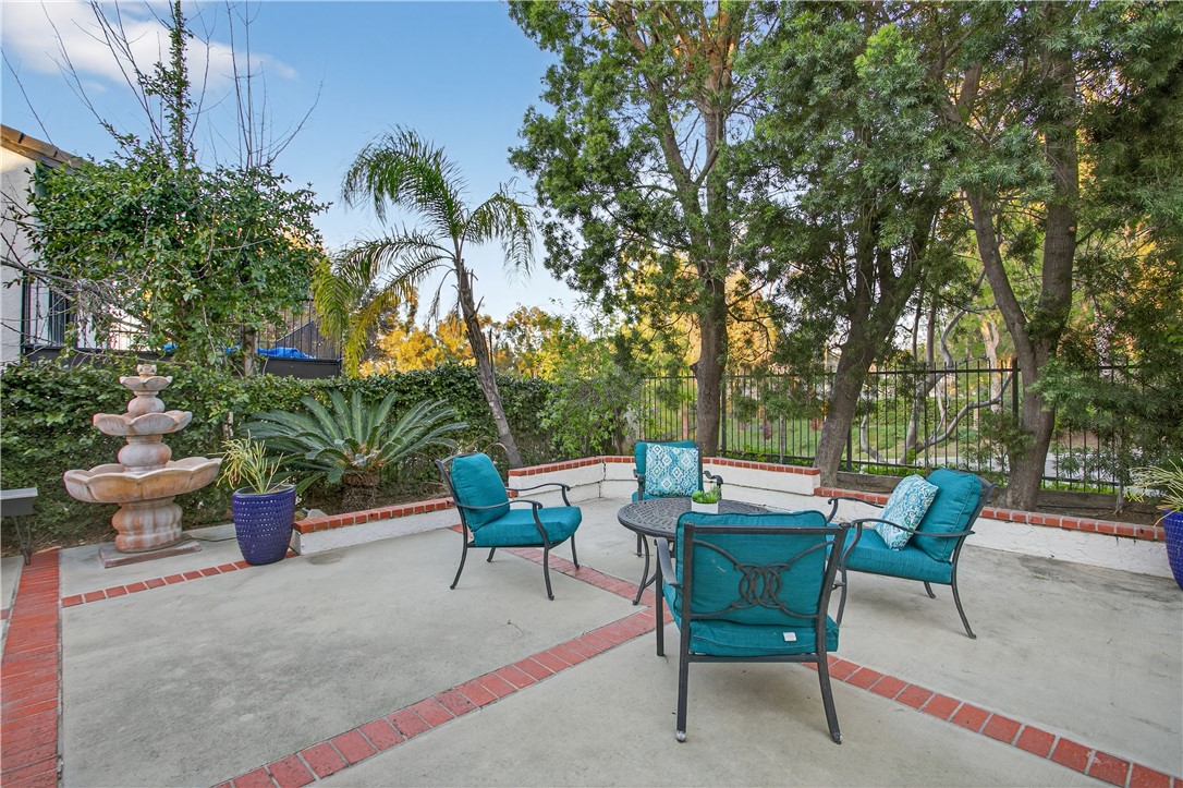 720 Ridgeview Road Anaheim Hills, CA 92807 - Photo 32 of 36 a view of a backyard with furniture and a fire pit