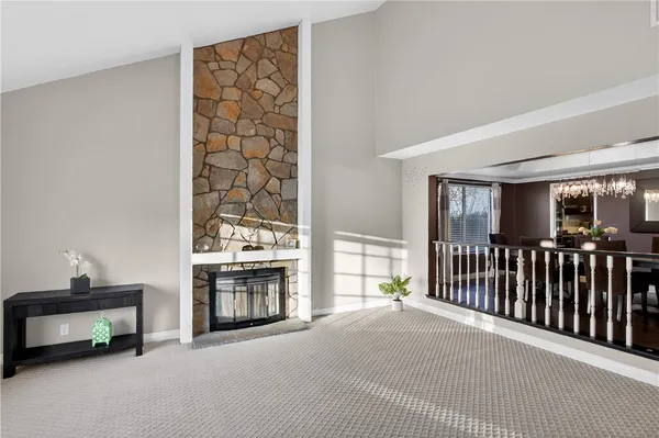 a view of a livingroom with furniture and a fireplace