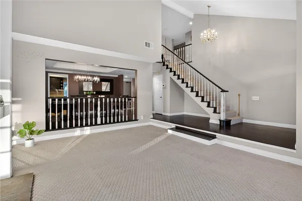 a view of a hallway with stairs