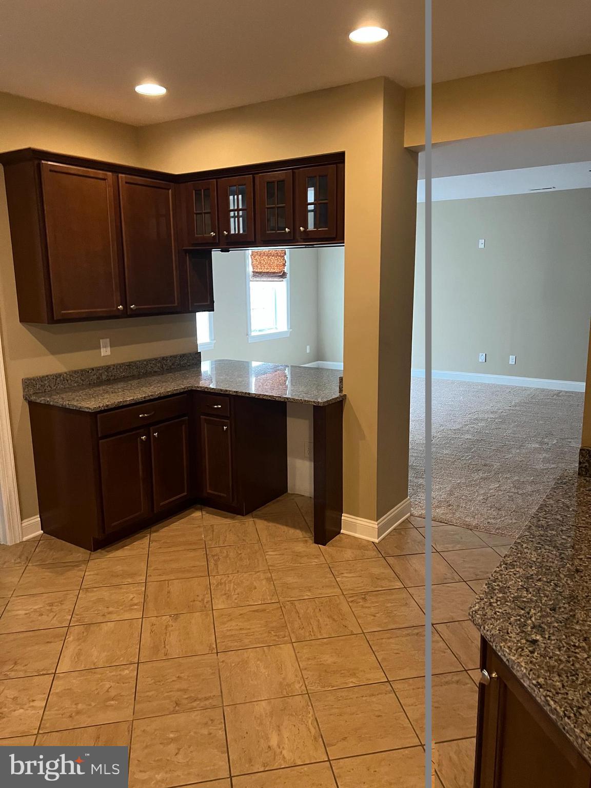 3913 Cap Stine Road Frederick, MD 21703 - Photo 17 of 19 a kitchen with stainless steel appliances granite countertop a sink and cabinets