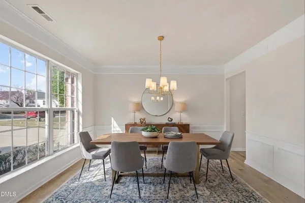 a view of a chandelier in big room and hallway