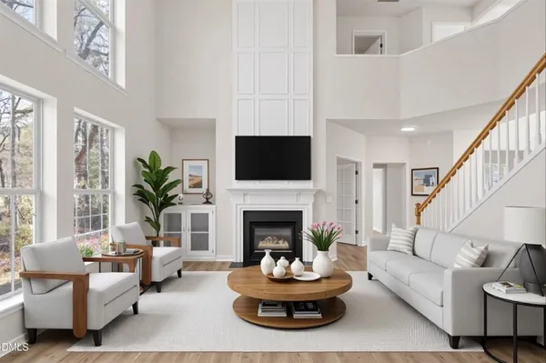a living room with a fireplace and a fireplace