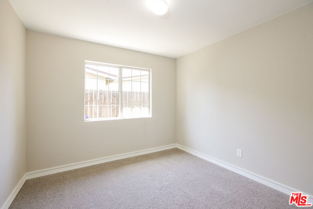 13014 Chestnut Avenue Rancho Cucamonga, CA 91739 - Photo 14 of 25 an empty room with a window