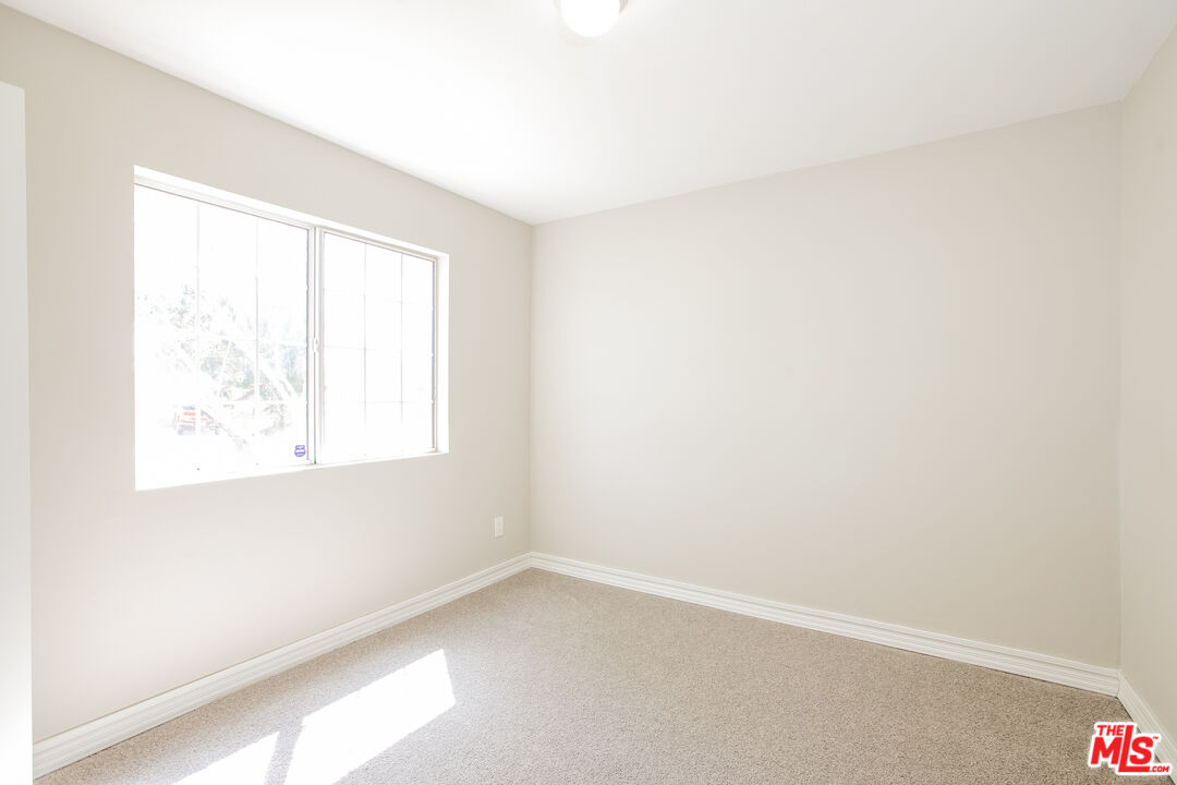 13014 Chestnut Avenue Rancho Cucamonga, CA 91739 - Photo 15 of 25 an empty room with a window