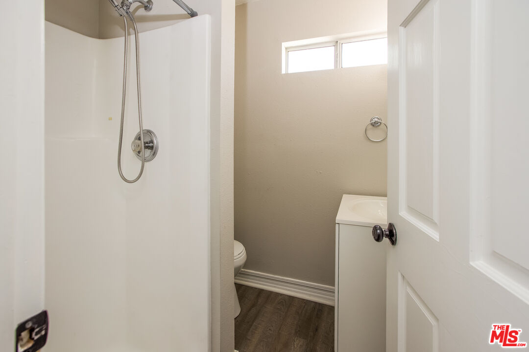 13014 Chestnut Avenue Rancho Cucamonga, CA 91739 - Photo 19 of 25 a bathroom with a glass shower door
