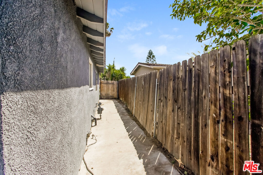 13014 Chestnut Avenue Rancho Cucamonga, CA 91739 - Photo 21 of 25 a view of a house with a wooden fence