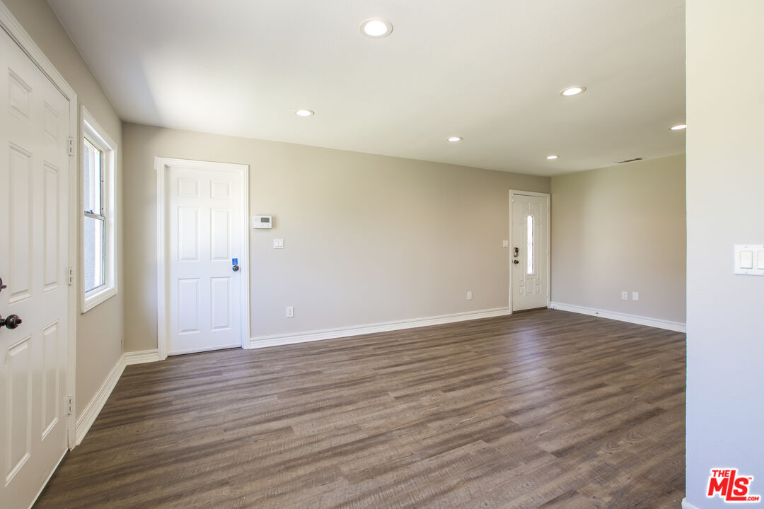 13014 Chestnut Avenue Rancho Cucamonga, CA 91739 - Photo 9 of 25 a view of an empty room with wooden floor