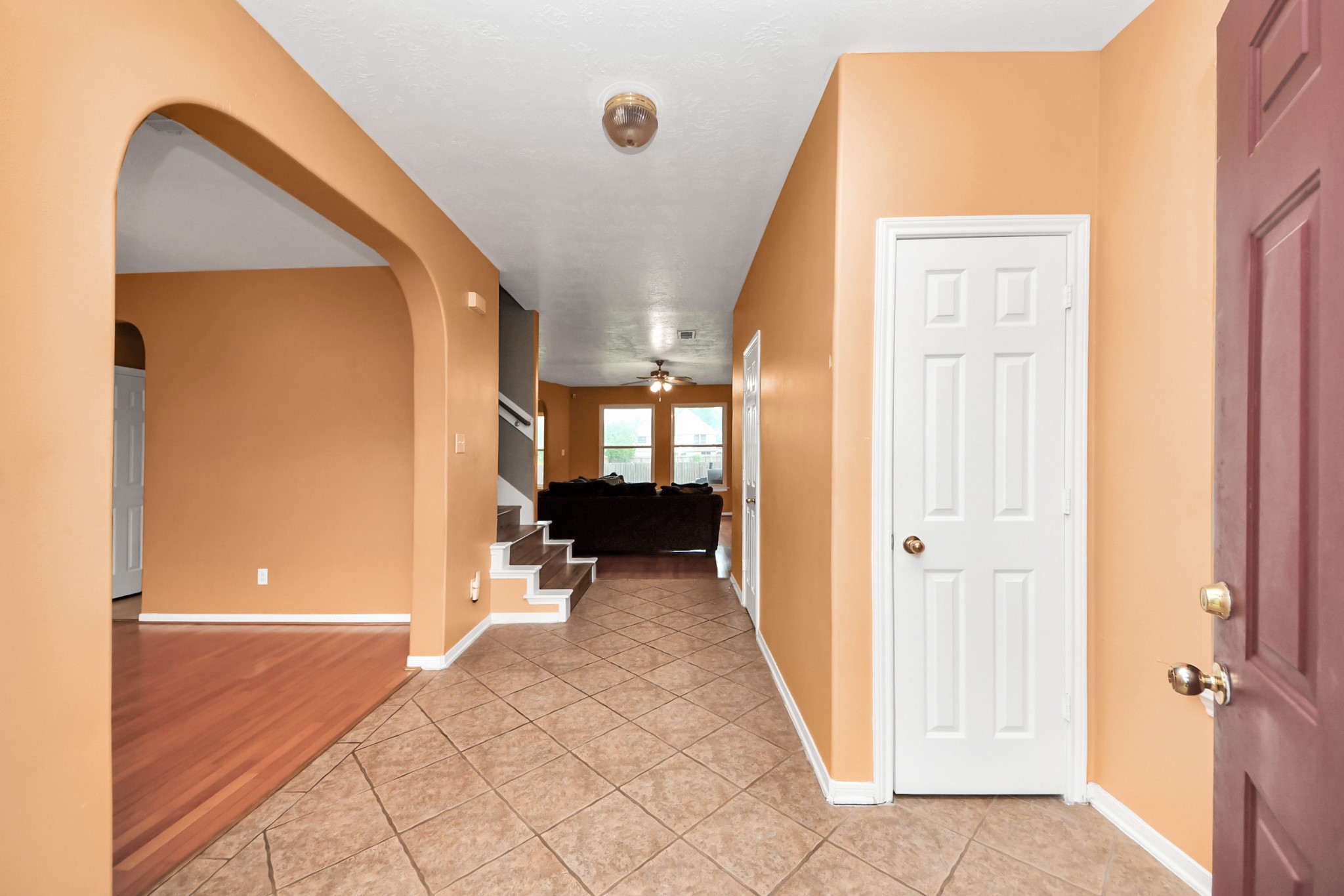 23814 Spring Dane Drive Spring, TX 77373 - Photo 8 of 41 a view of a hallway with wooden floor and a living room
