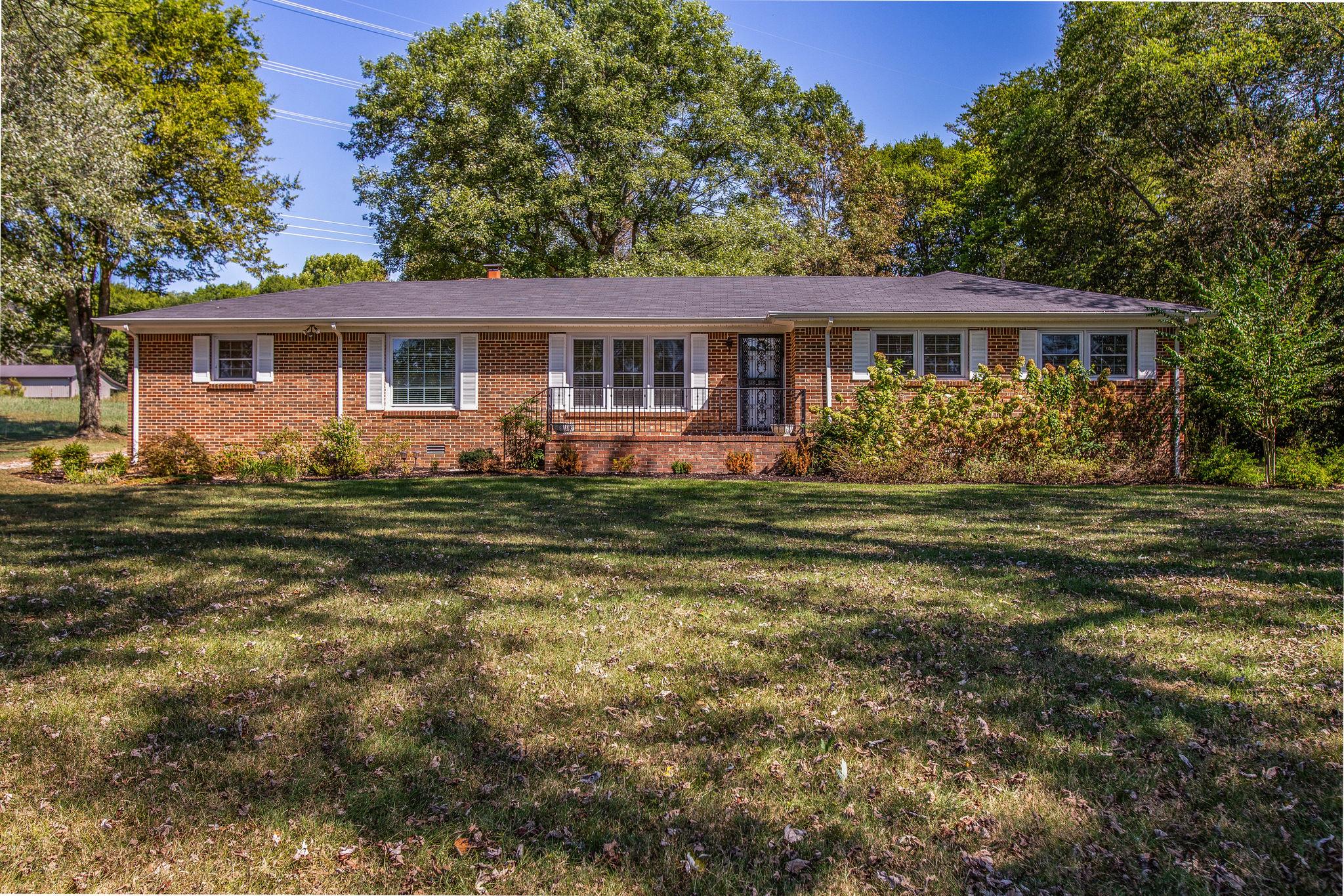 2173 Double Branch Road Columbia, TN 38401 - Photo 1 of 17 a front view of a house with a garden
