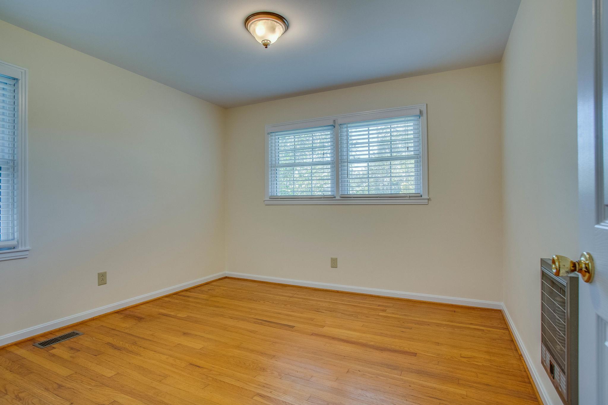 2173 Double Branch Road Columbia, TN 38401 - Photo 11 of 17 an empty room with wooden floor and windows