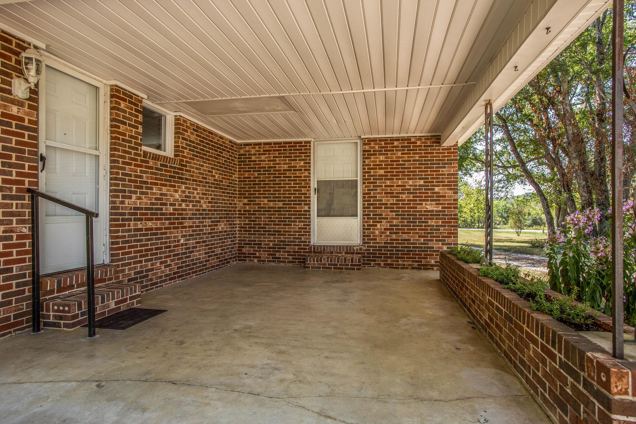 2173 Double Branch Road Columbia, TN 38401 - Photo 14 of 17 a view of a porch with furniture and yard
