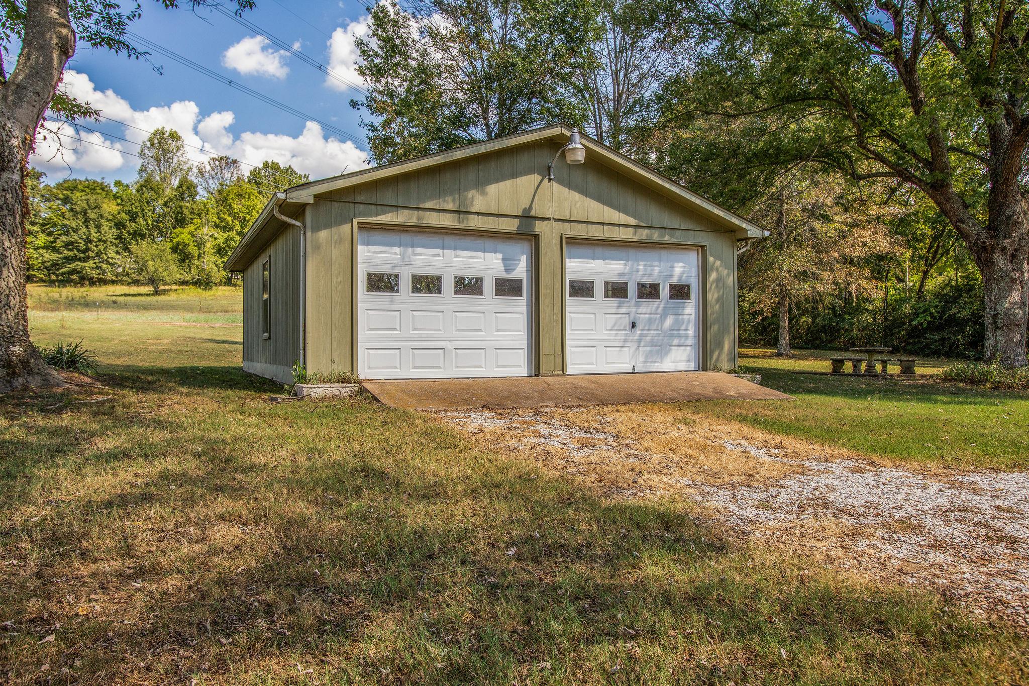 2173 Double Branch Road Columbia, TN 38401 - Photo 16 of 17 a front view of a house with a garden