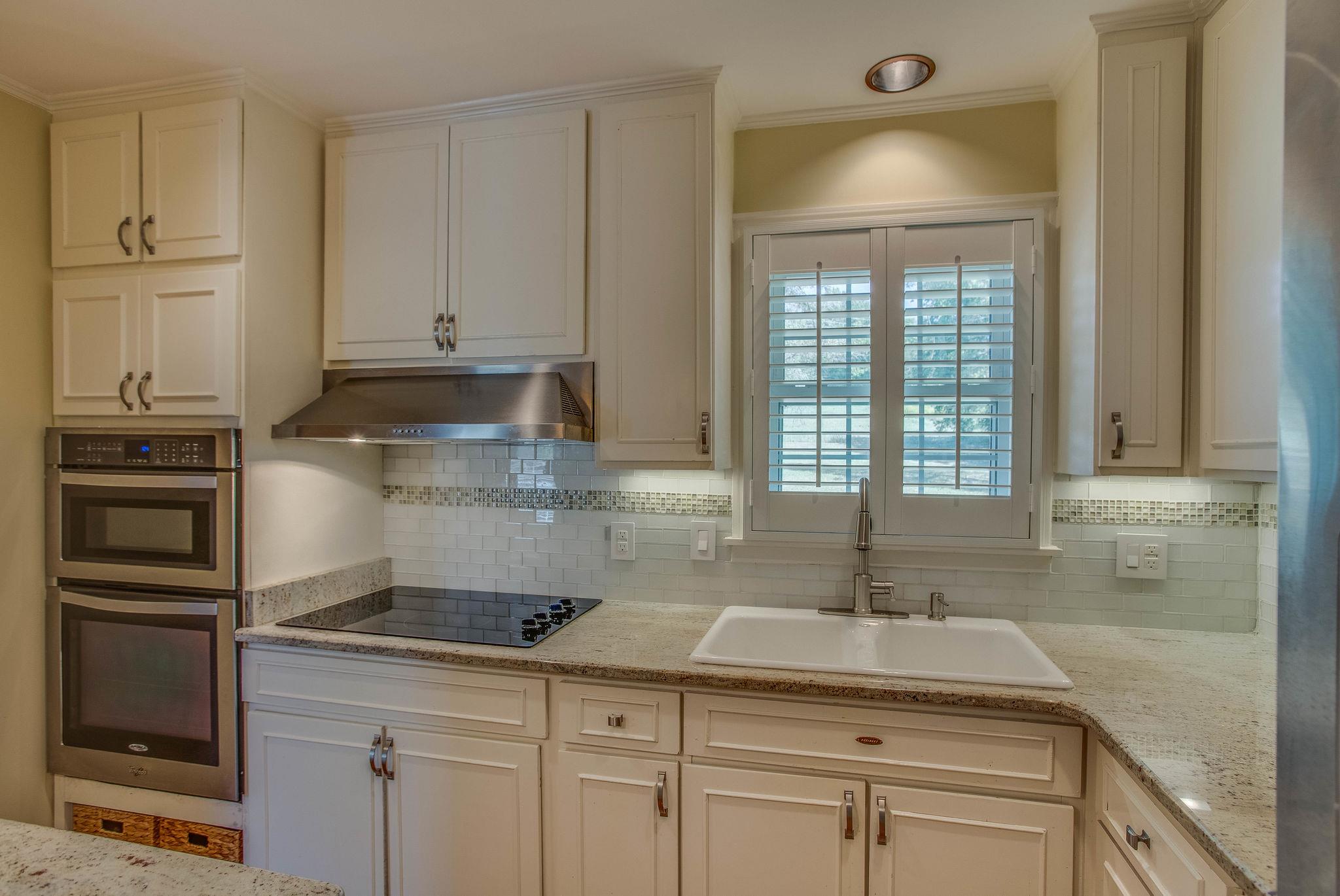 2173 Double Branch Road Columbia, TN 38401 - Photo 7 of 17 a kitchen with stainless steel appliances granite countertop a sink a stove and cabinets