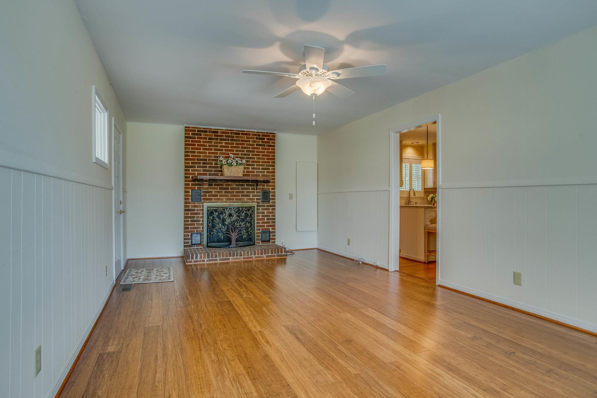 2173 Double Branch Road Columbia, TN 38401 - Photo 8 of 17 a view of an empty room with wooden floor and a window