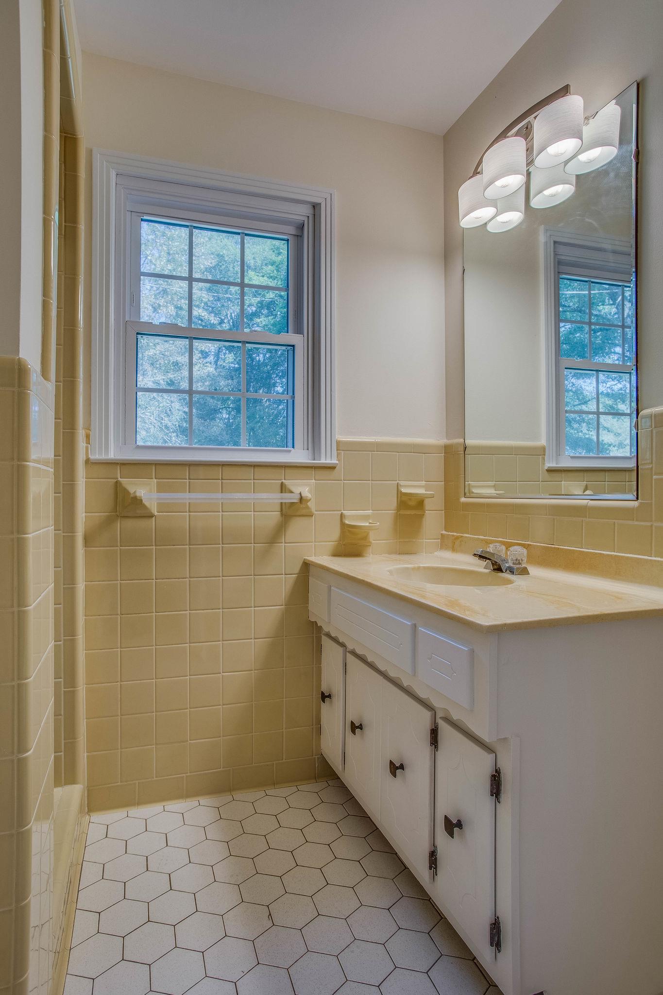 2173 Double Branch Road Columbia, TN 38401 - Photo 10 of 17 a bathroom with a sink double vanity and a shower