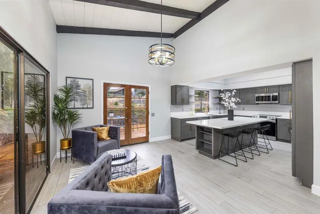 a living room with furniture and a table