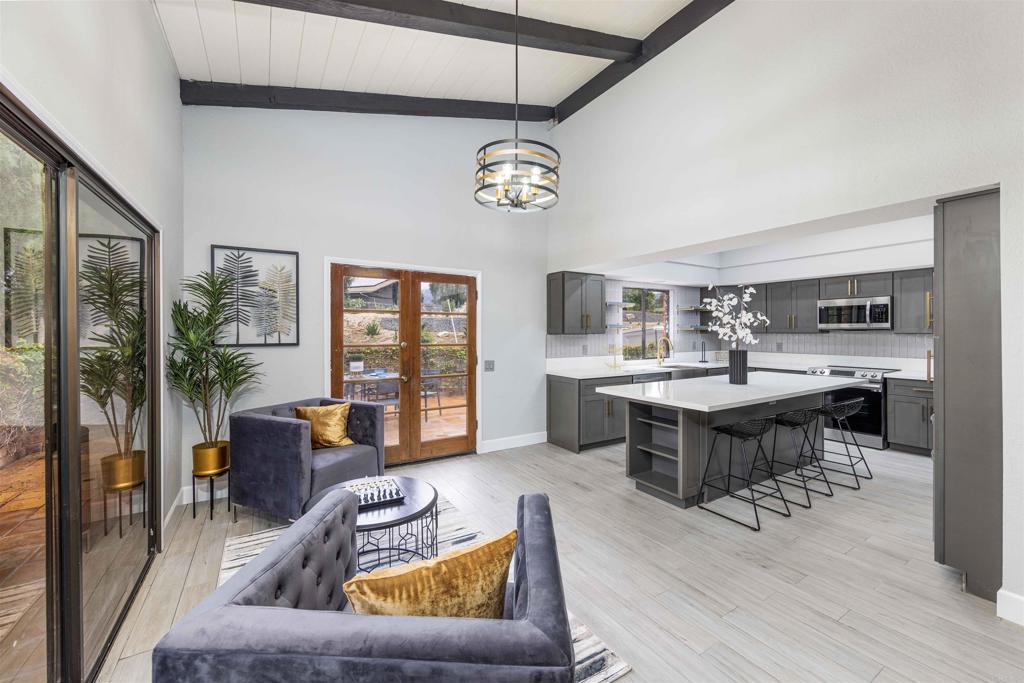 32404 Womsi Road Pauma Valley, CA 92061 - Photo 12 of 34 a living room with furniture and a table