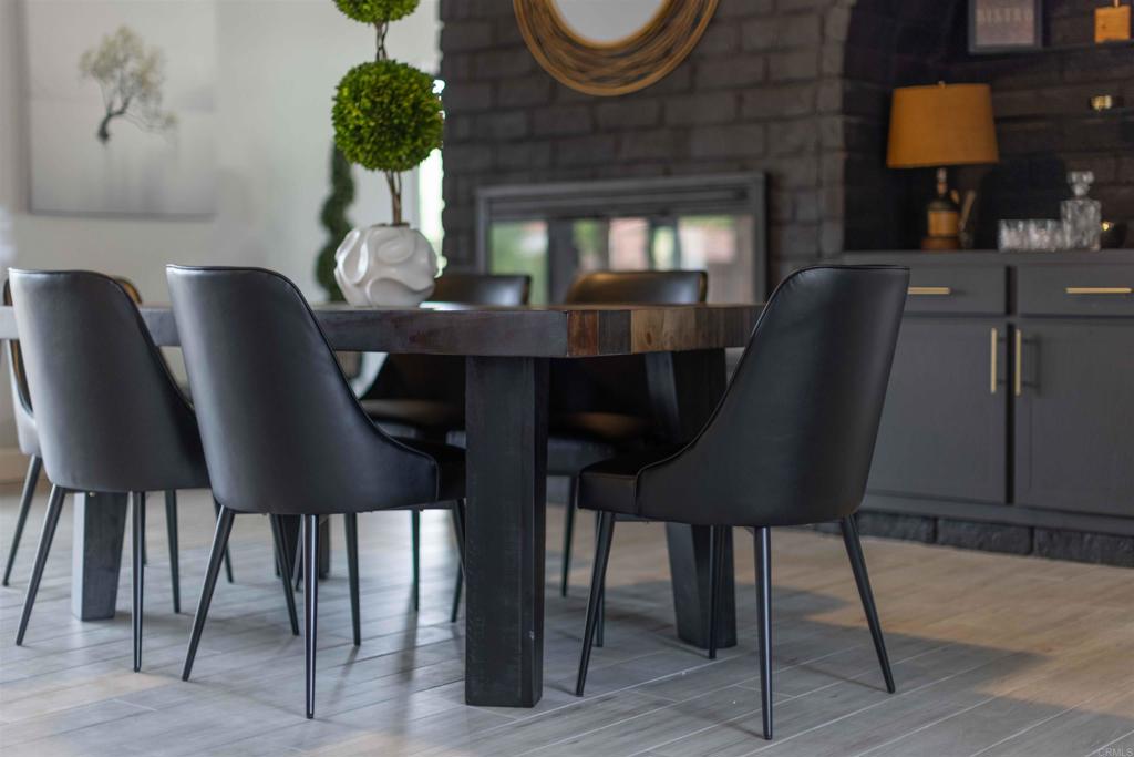 32404 Womsi Road Pauma Valley, CA 92061 - Photo 15 of 34 a view of a dining room with furniture and wooden floor