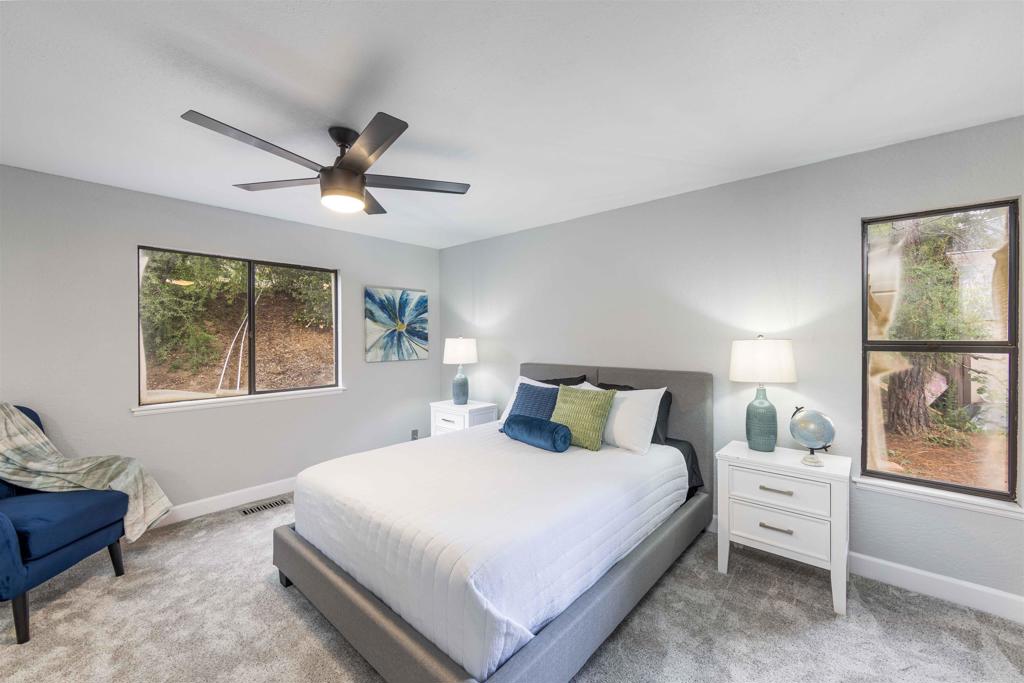 32404 Womsi Road Pauma Valley, CA 92061 - Photo 24 of 34 a bedroom with a large bed and a window