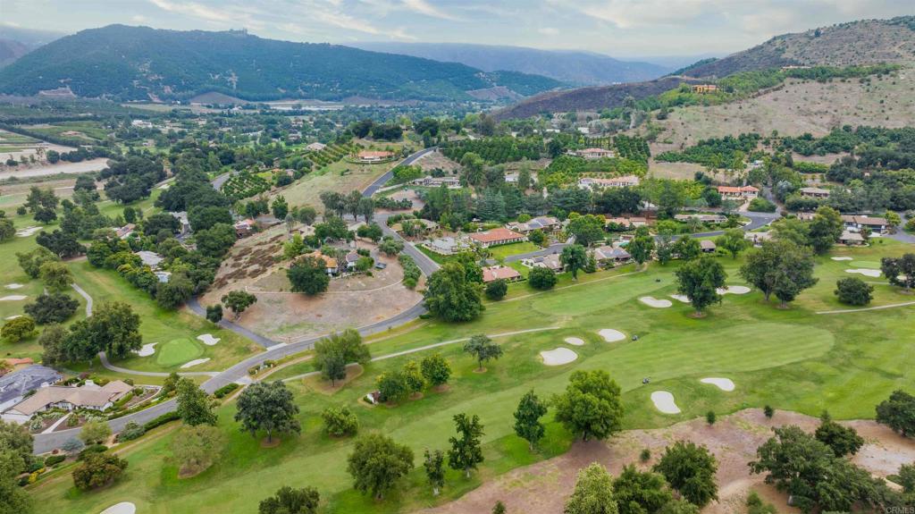 32404 Womsi Road Pauma Valley, CA 92061 - Photo 31 of 34 a view of a lush green hillside and houses