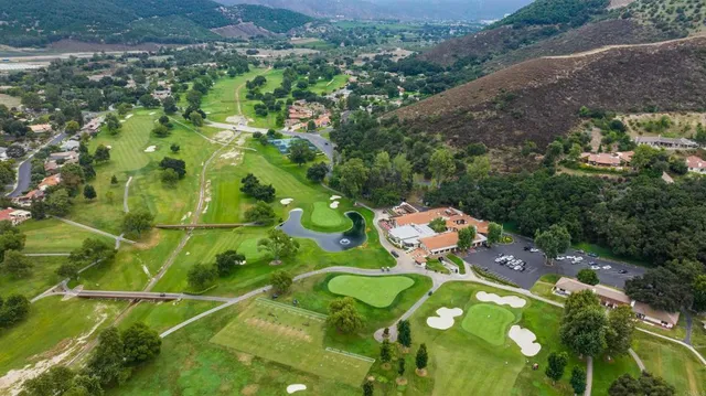a bird view of multi story residential area with lots of trees