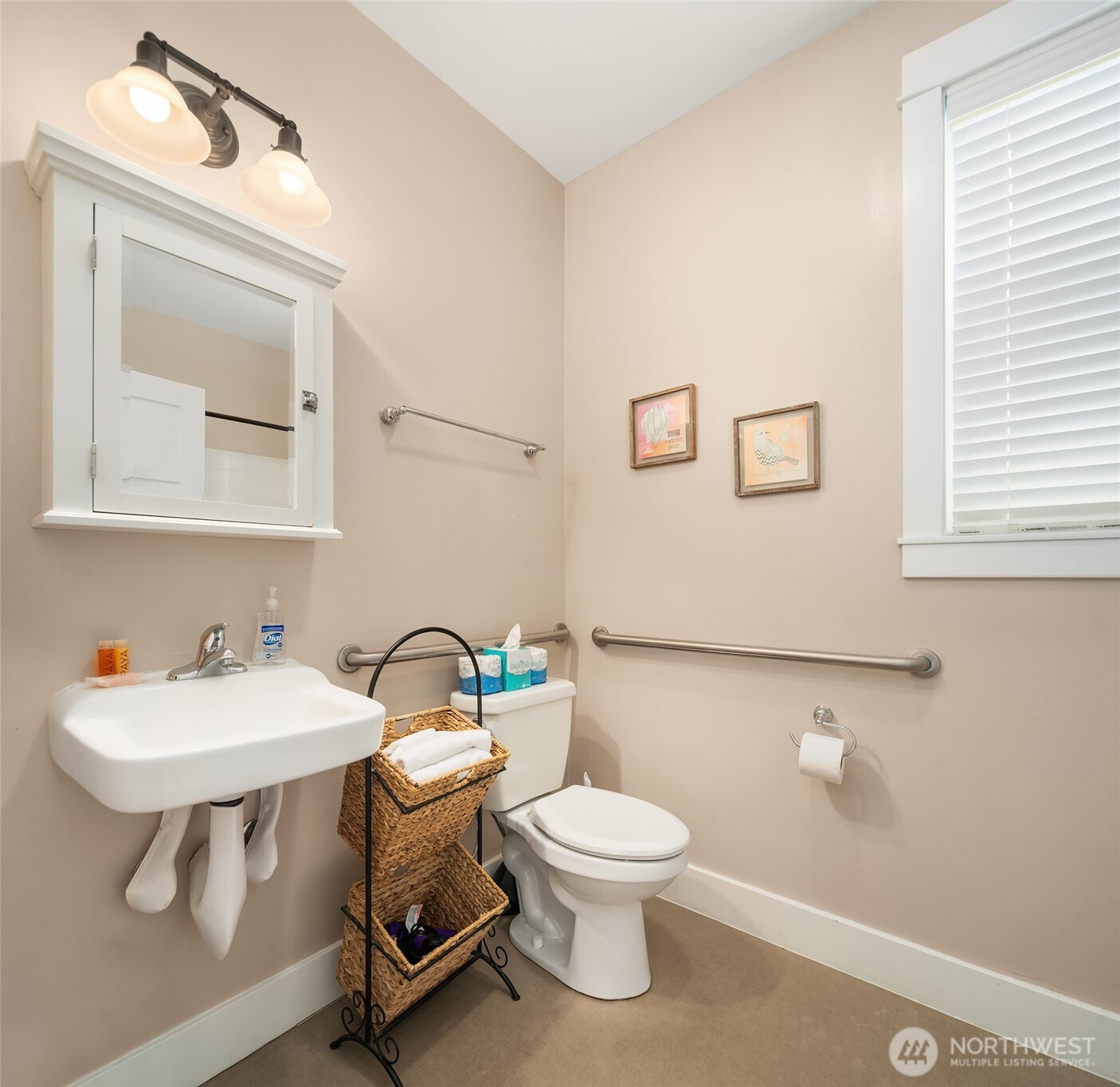 24 Float Lane Pacific Beach, WA 98571 - Photo 21 of 23 a white toilet sitting next to a bathroom sink