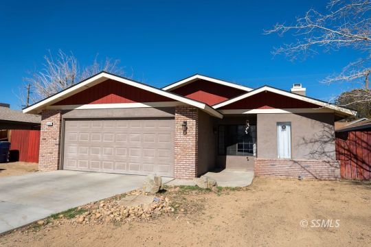 644 Beth Lane Ridgecrest, CA 93555 - Photo 1 of 31 a front view of a house with a yard