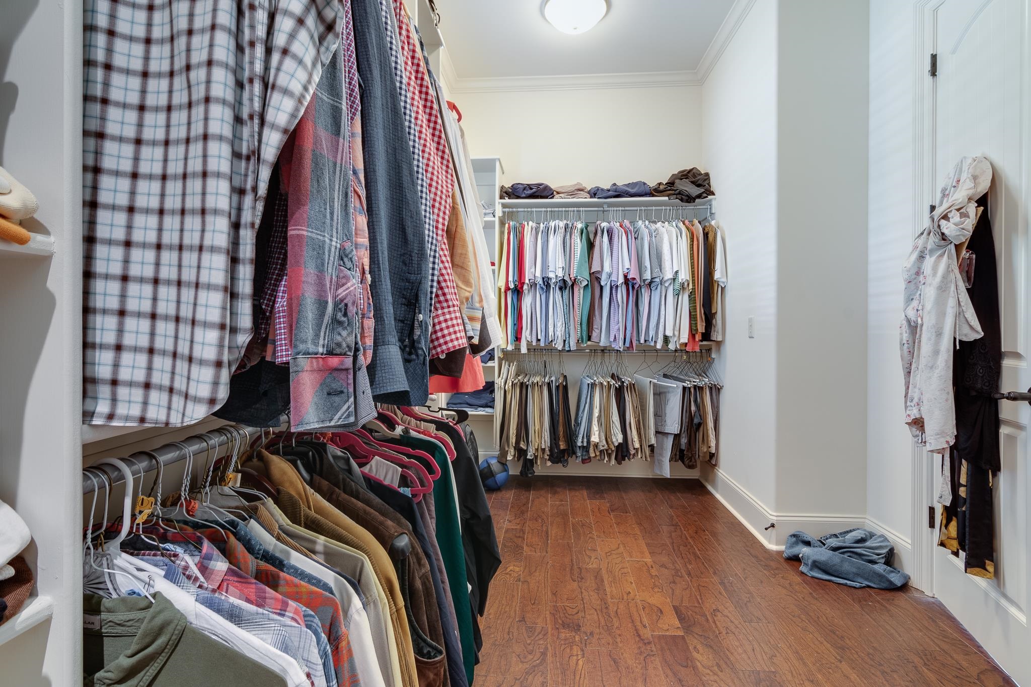 5245 Cole Road Memphis, TN 38120 - Photo 12 of 25 a view of walk in closet with clothes and shoes