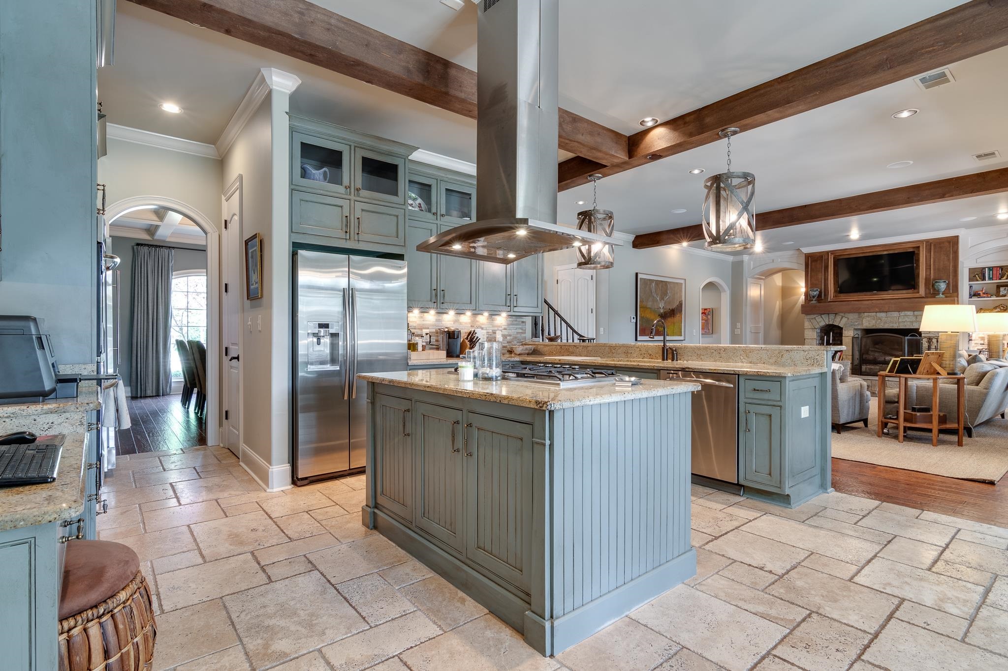 5245 Cole Road Memphis, TN 38120 - Photo 14 of 25 a kitchen with stainless steel appliances granite countertop a stove a sink and a refrigerator