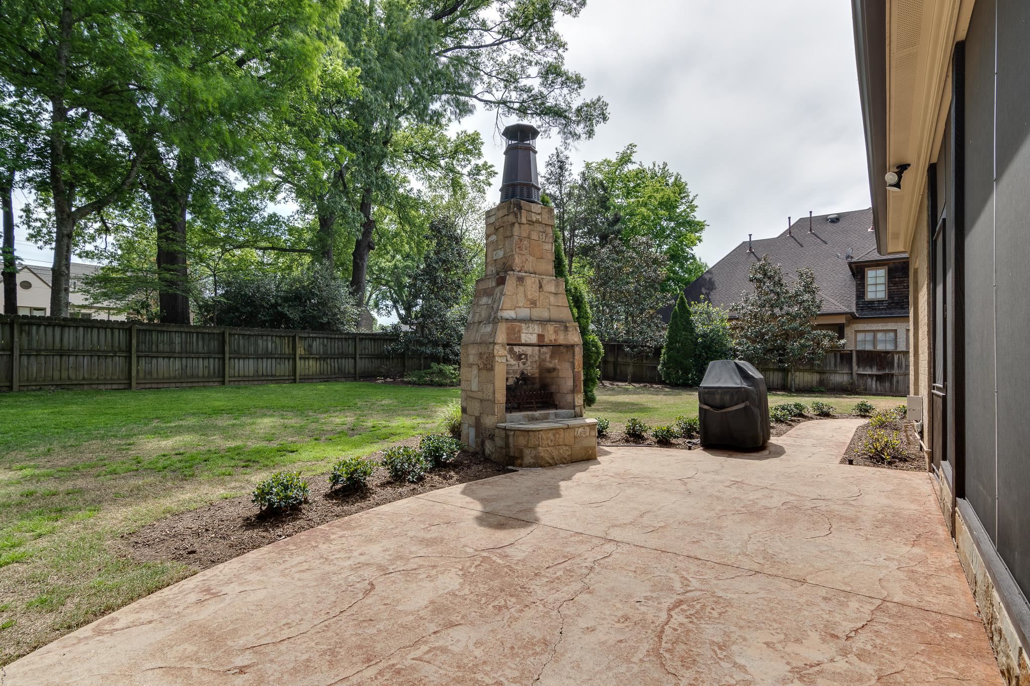 5245 Cole Road Memphis, TN 38120 - Photo 24 of 25 a view of a garden with a slide