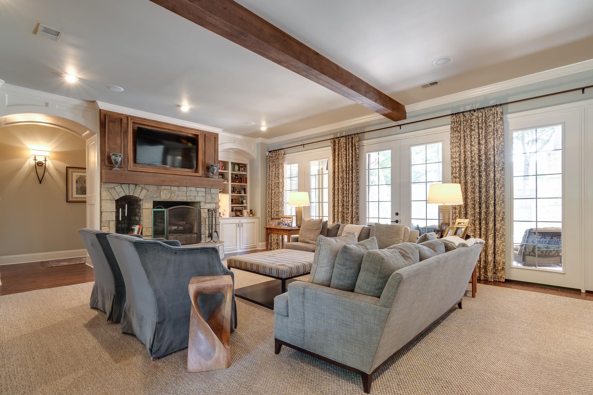 5245 Cole Road Memphis, TN 38120 - Photo 6 of 25 a living room with furniture a fireplace and a large window