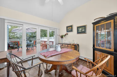 a balcony with table and chairs