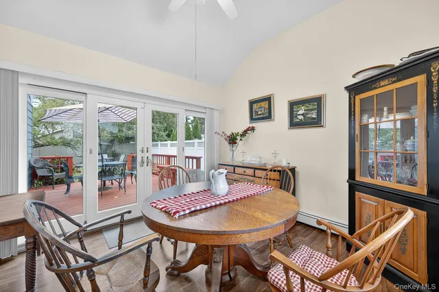 a balcony with table and chairs
