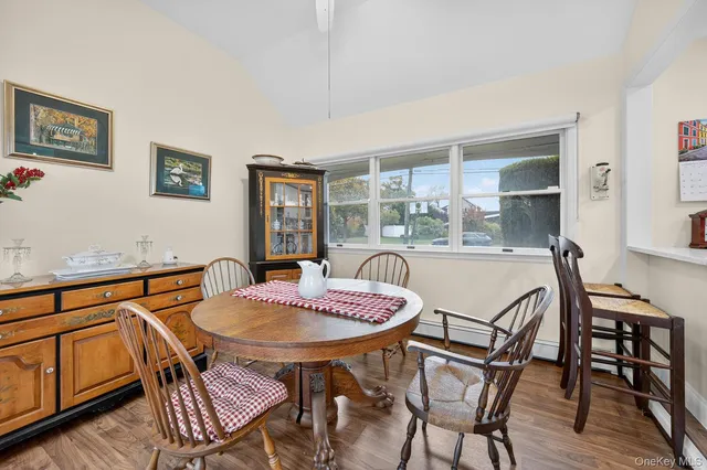 a dining room with furniture and window