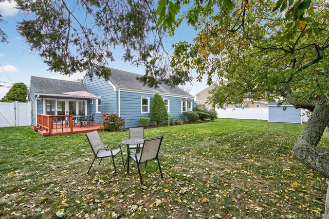 a house view with a seating space and garden