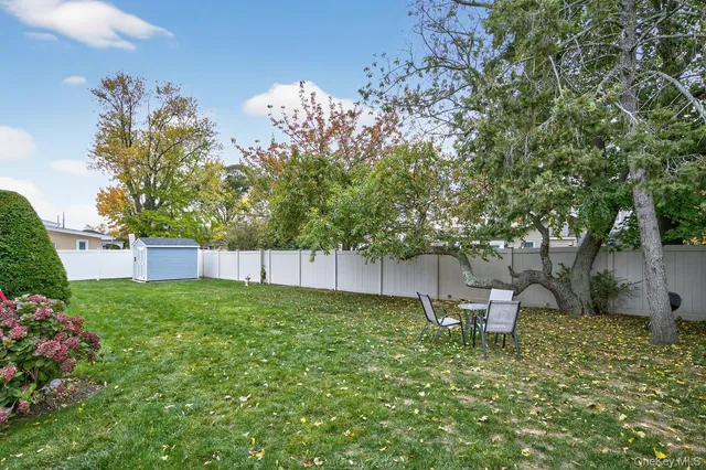 a view of a backyard with plants and garden