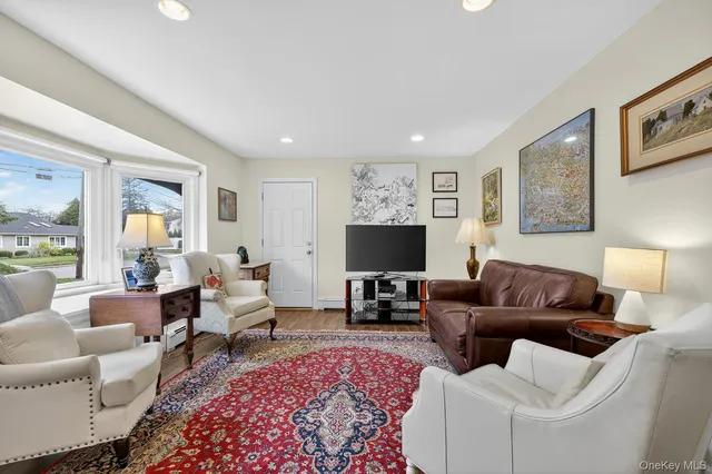 a living room with furniture or couch and a flat screen tv