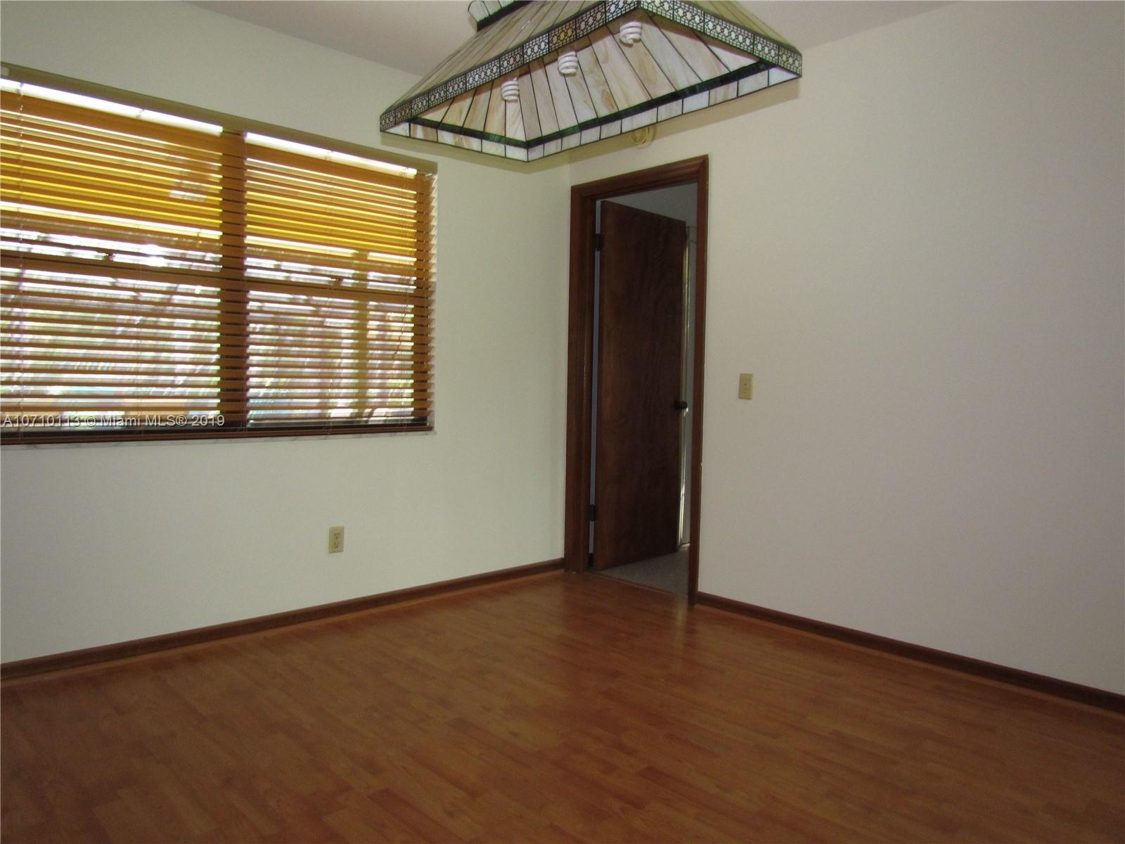 10825 Sandy Run Road Jupiter, FL 33478 - Photo 24 of 31 an empty room with a window