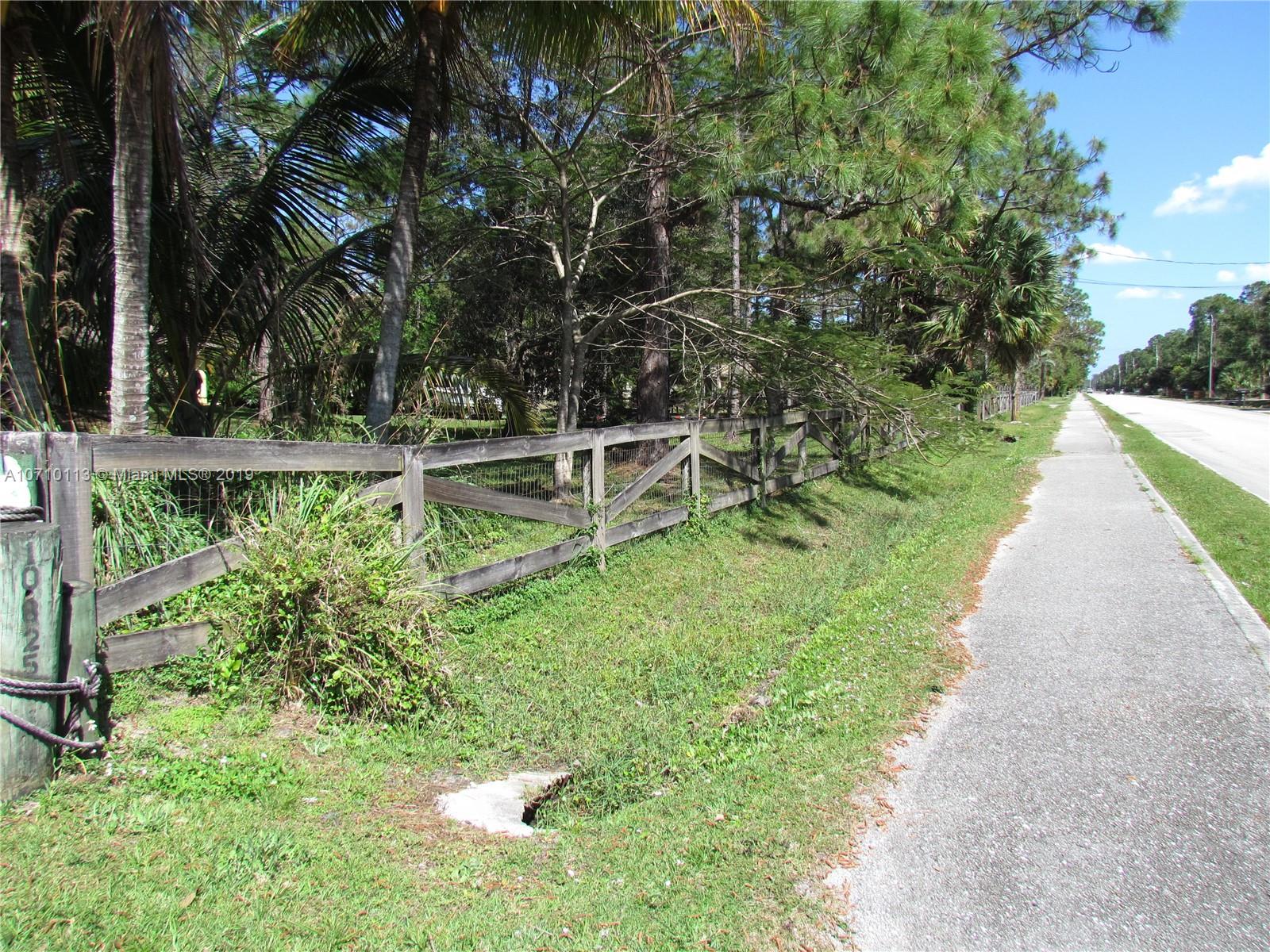 10825 Sandy Run Road Jupiter, FL 33478 - Photo 6 of 31 a view of a backyard with a garden
