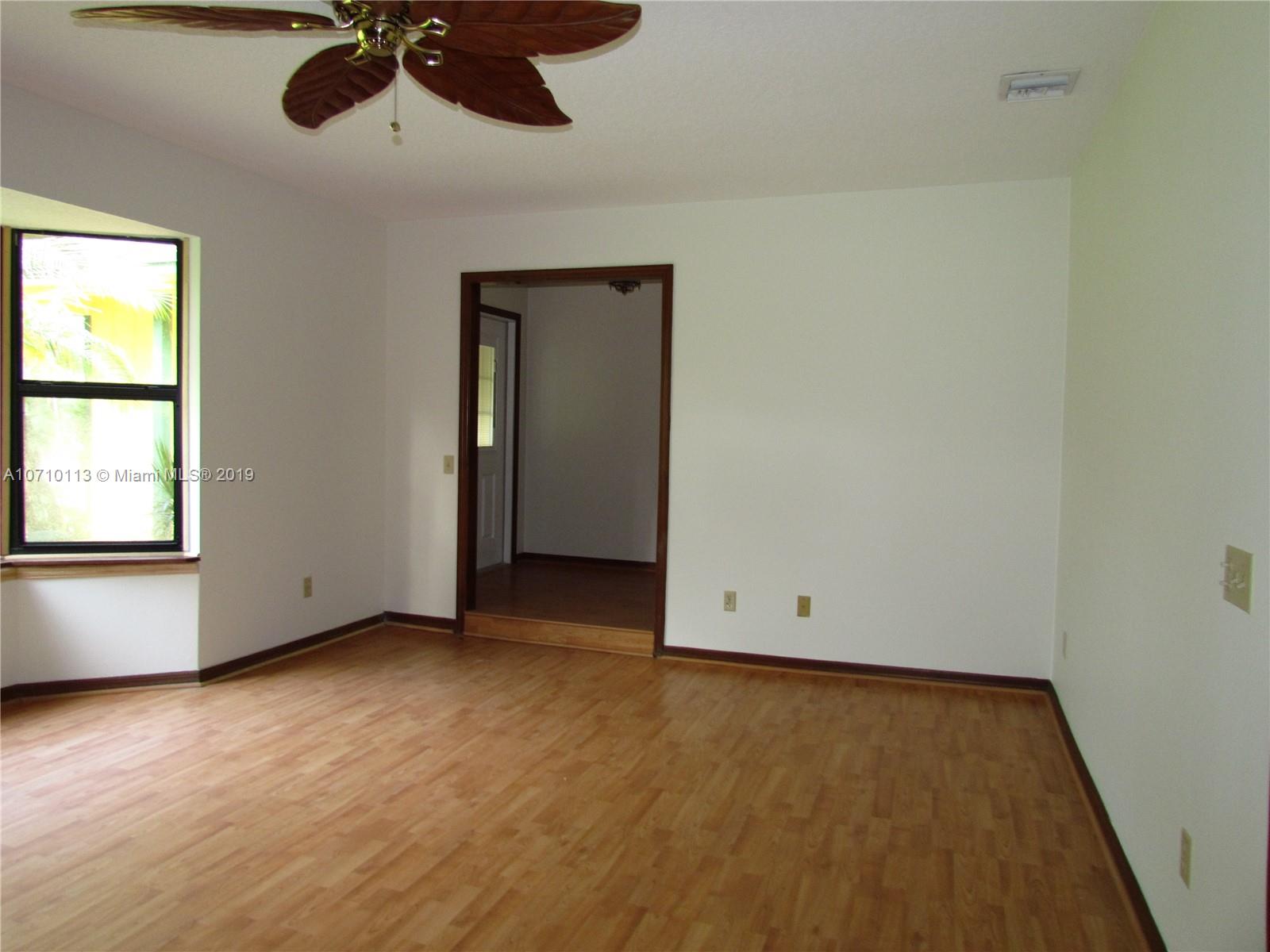 10825 Sandy Run Road Jupiter, FL 33478 - Photo 8 of 31 an empty room with a window
