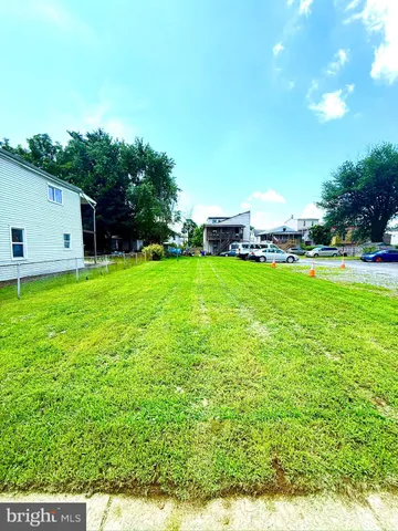 a view of a backyard with plants and a garden