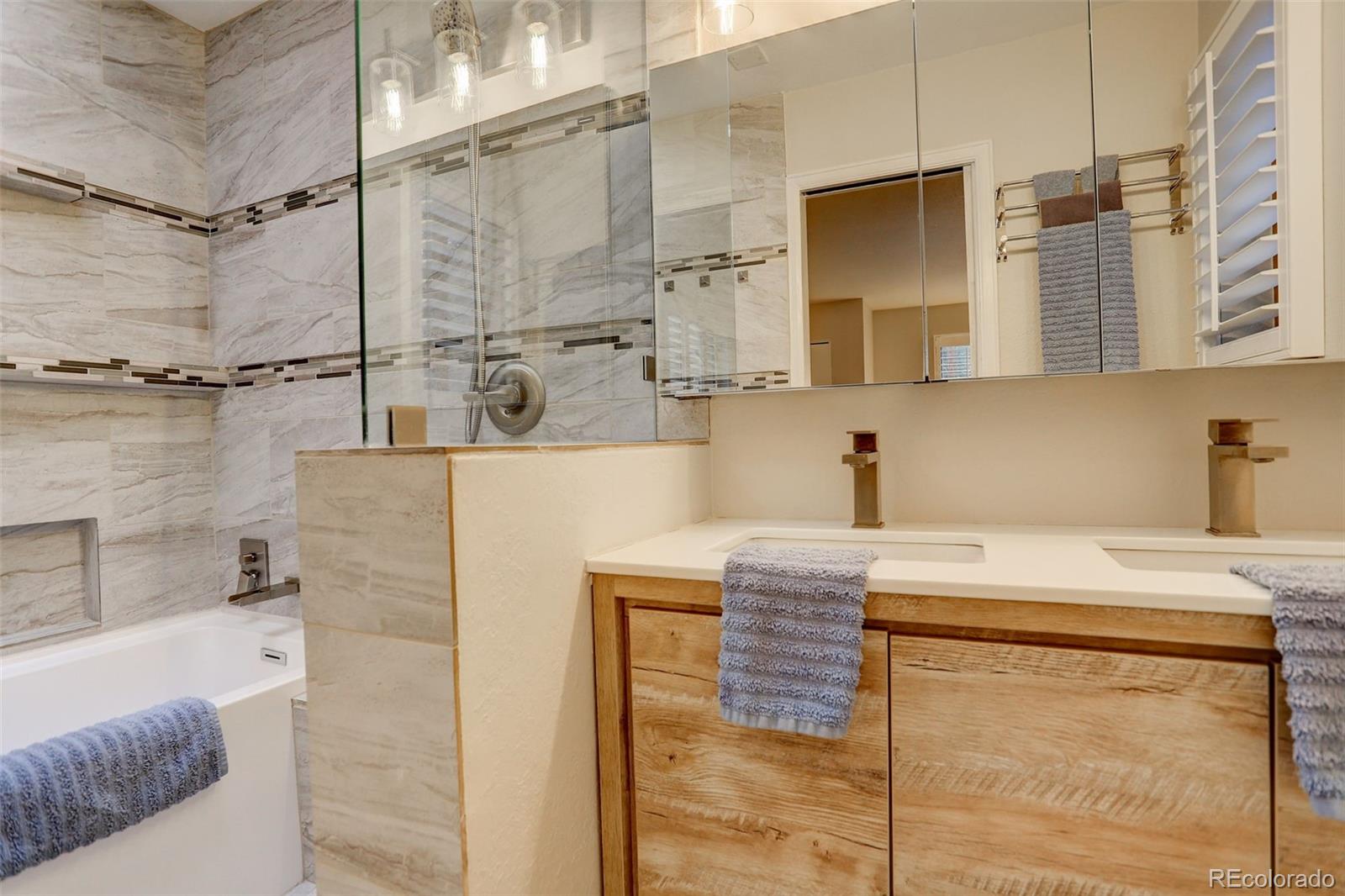 6997 South Columbine Road Evergreen, CO 80439 - Photo 16 of 40 a bathroom with a sink and a shower